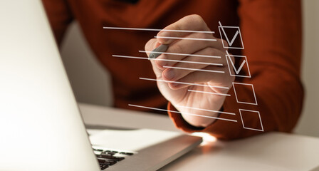 Paperless workplace idea, e-signing, electronic signature, document management. A businessman signs...