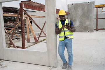 Portrait African American engineer man use smart phone with precast cement at precast cement...