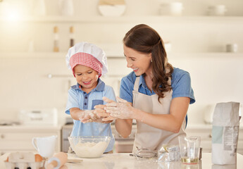 Mother, teaching and baking with child in kitchen for bonding, learning and growth for development....
