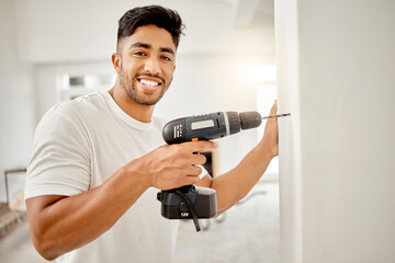 Portrait, wall and man with drill tool for home with diy building, renovation or maintenance....