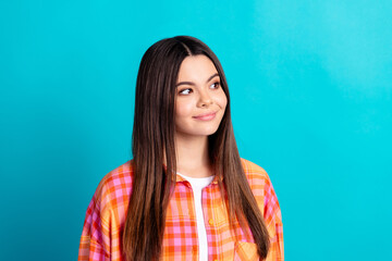 Photo of nice young girl look empty space wear plaid shirt isolated on teal color background