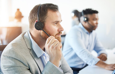 Man, listening and call center with microphone in office for support, customer or problem in...