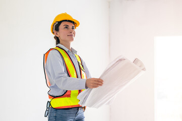 Female Architect Holding Blueprints at Construction Site