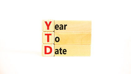 YTD year to date symbol. Concept words YTD year to date on beautiful wooden blocks. Beautiful white...