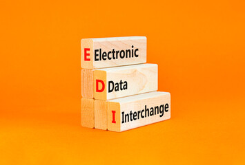 EDI electronic data interchange symbol. Concept words EDI electronic data interchange on blocks. Beautiful orange background. Business and EDI electronic data interchange concept. Copy space.
