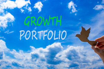 Growth portfolio symbol. Concept words Growth portfolio on beautiful sky. Beautiful blue sky cloud...