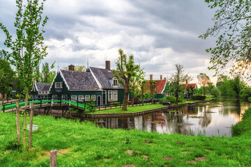 Fototapeta premium Traditional dutch houses on street in historic village Zaanse Schans.