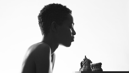 Attractive black woman playing chess