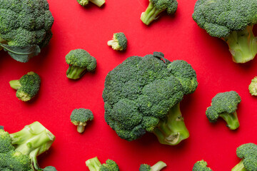 green fresh broccoli background close up on colored table. Vegetables for diet and healthy eating....