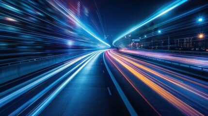 Urban traffic moves swiftly along a city highway during the evening rush hour, with car headlights and bustling night transport creating an abstract long exposure photograph with a motion blur 