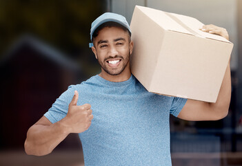 Delivery, thumbs up and portrait of man for logistics, box and shipping service in city or town....