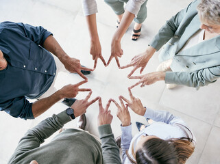 Teamwork, business people and hands in star shape for top view, support and solidarity for...