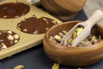 making homemade chocolate with cocoa butter and nuts