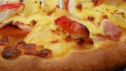 Tropical twist: Savory cheese, sweet pineapple, and succulent crab sticks make a delectable Hawaiian-inspired pizza. Food and Diet concept. Pizza background. 
