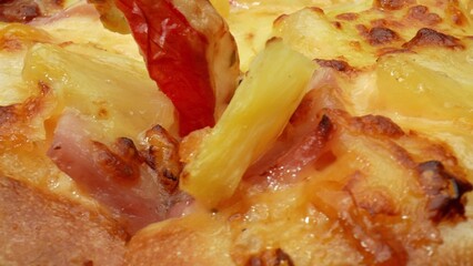 Experience the unique blend of sweet pineapple, melted cheese, and savory crab sticks atop a pizza,...