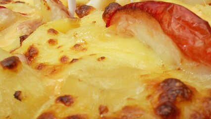 Tropical twist: Tangy pineapple, creamy cheese, and succulent crab sticks combine for a Hawaiian-inspired delight on your pizza. Fast food concept. Pizza background. 
