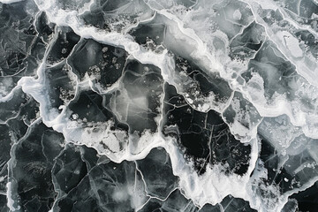Aerial view of ice floes in a frozen sea, capturing the abstract patterns and textures formed by the ice. Emphasize the natural lines and the contrast between the white ice and the dark water.