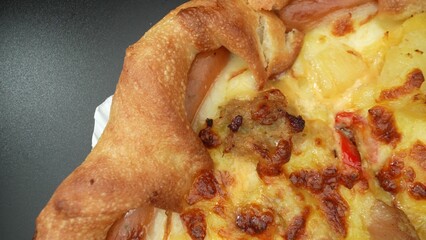 Experience pizza perfection like never before: a symphony of cheese and sausage in glorious macro detail. Process food concept. Pizza background. 
