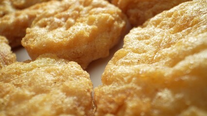 Chicken nuggets have become a staple in many households and restaurants around the world, offering a convenient and satisfying option for chicken lovers everywhere. Junk food concept. Food background.