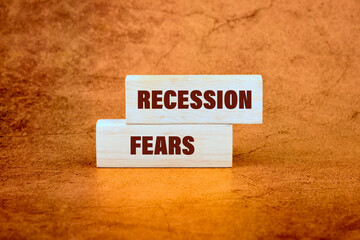 Recession fears symbol. Concept words RECESSION FEARS on wooden beams on a bright beautiful...