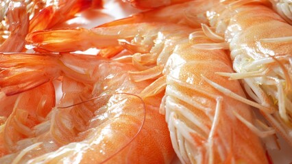 When properly cooked, frozen shrimp with shells have a firm yet tender texture. The shell adds a...