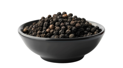 A black bowl filled with ground black pepper, enhancing the flavors of dishes with its aromatic and spicy notes