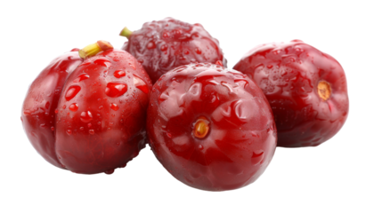 A group of red fruits stacked on top of each other in a balanced composition