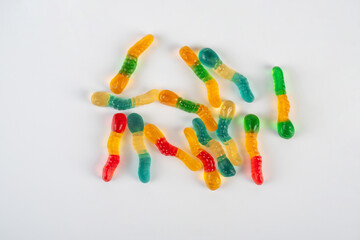 Fruit flavored worm shape, jelly candies. Isolated on white background.