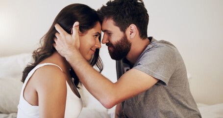Fototapeta premium Couple, people and home with forehead touch in bedroom with smile, together and support for unity. Relationship, happy and bonding for romance in morning for care, love and trust as soulmate