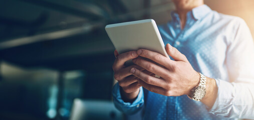 Business man, tablet and hands in office with technology, reading and research for content creation...