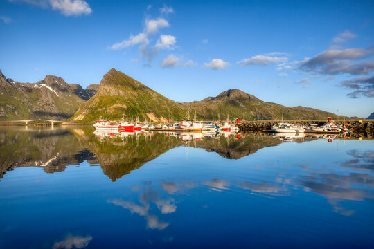 Pier with Fishing Boats on a Calm Evening at Fredvang on Moskenes Island in Lofoten, Norway, Looking towards the Mountains of Flakstad Island
