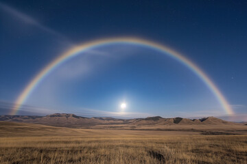 Full Moon Halo Over Open Field with Clear Night Sky