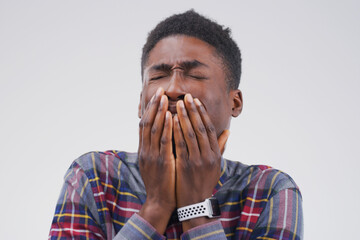 It wasnt me. Black man, crying and hurt in studio for drama, horror and scared on white background....