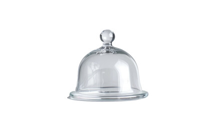 A transparent glass cloche placed on a plain white surface, creating a minimalist and elegant aesthetic