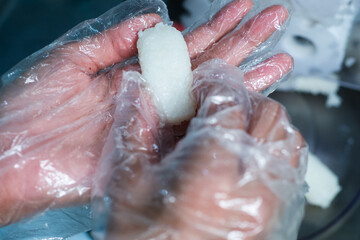 Japanese rice made with an automatic rice molding machine for making sushi.