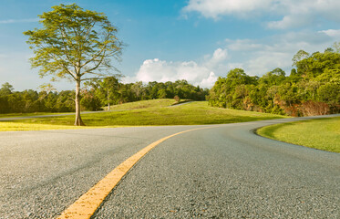 Outdoor forest road.Beautiful long asphalt road in rich nature.
