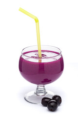 A glass of 'Indian blackberry' or Jamun (Syzygium cumini) Shake, Pulp, or Juice with the whole fresh fruit, isolated on a white background.