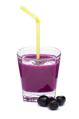 A glass of 'Indian blackberry' or Jamun (Syzygium cumini) Shake, Pulp, or Juice with the whole fresh fruit, isolated on a white background.