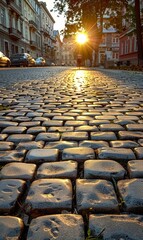 Fototapeta premium Golden Sunset on Cobblestone Street in Historical European Town
