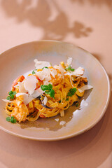 Gourmet tagliatelle pasta with shrimp and parmesan