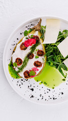 Gourmet stuffed eggplant with arugula and cheese