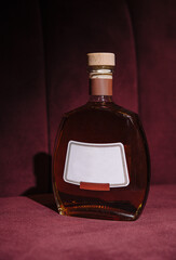 Premium bottle of brandy on elegant background