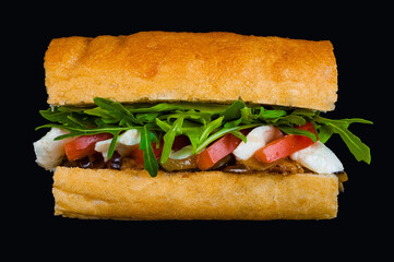 Fresh italian sub sandwich on black background