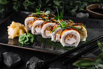 Gourmet sushi rolls on elegant slate plate