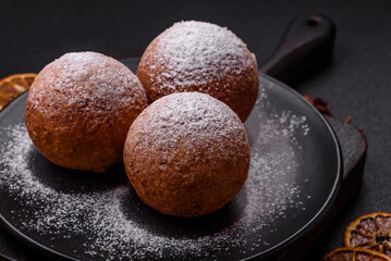 Round homemade cheese donuts glazed with citrus flavor