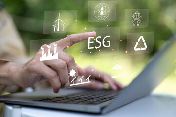 ESG. Environment social governance investment business concept. Businessmen use a computer to...