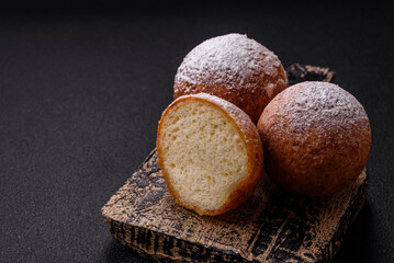 Round homemade cheese donuts glazed with citrus flavor