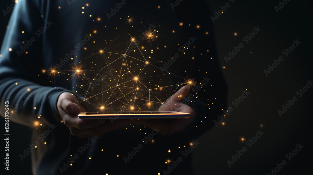 Poster an individual interacts with a tablet that emits a bright, futuristic network of nodes and lights
