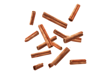 Falling cinnamon stick isolated on white background