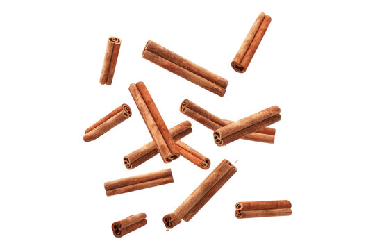 Falling cinnamon stick isolated on white background